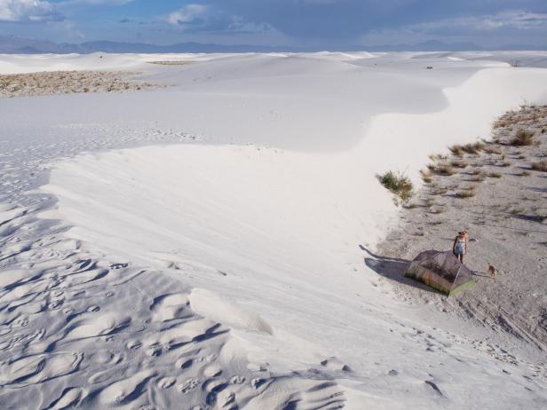 Woman and Dog Camping at White Sands, New Mexico Woman and Dog Camping at White Sands, New Mexico