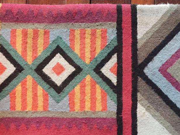 Close Up of Rug With Stripes and Geometric Patterns