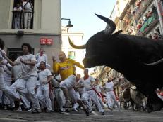 Head to Spain to run with the bulls during the San Fermin Festival.