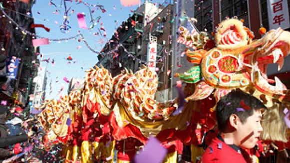 Confetti falls as a dragon dance troupe performs during the annual Chinese Lunar New Year parade in New York's Chinatown February 6, 2011. The Lunar New Year began on February 3 and marks the start of the Year of the Rabbit, according to the Chinese zodiac. REUTERS/Jessica Rinaldi (UNITED STATES - Tags: SOCIETY)
