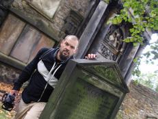 Aaron stands next to a grave in Greyfriars, which is believed to be one of the most haunted cemeteries in the world.