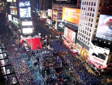 Revellers fill the streets of Times Square during New Year's Eve celebrations in New York, December 31, 2010.     REUTERS/Gary Hershorn (UNITED STATES - Tags: ANNIVERSARY SOCIETY)