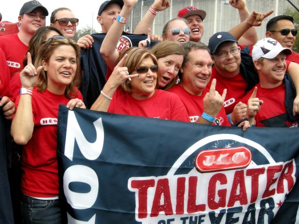 A crowd of Texans tailgaters showing team pride
