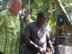 Andrew Zimmern with cooks catch of the day with Thomas Daley in St. Croix