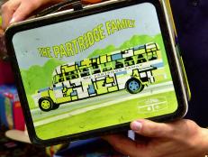 On the Platinum Hits episode, Billy Leroy wins a bid for a vintage Partridge Family lunch box. But what's the cost? Did Billy put in the entire “kit and caboodle” for this win?