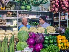 Andrew Zimmern among produce in Lima