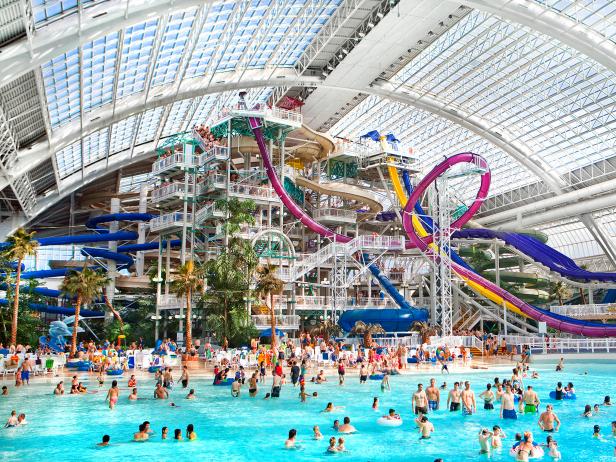indoor waterpark, people, long slides, natural light, indoor waterpark, people, long slides, natural light,