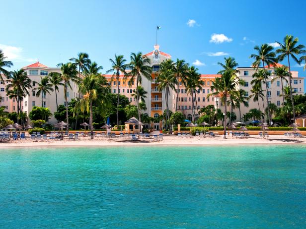 resort, palm trees, teal ocean, blue sky, resort, palm trees, teal ocean, blue sky,