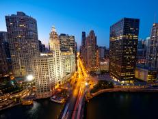 aerial view of tall buildings and busy street at dusk in chicago
