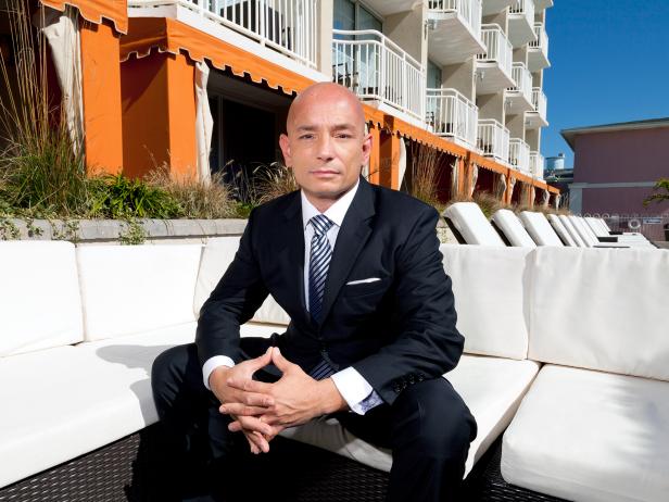 anthony melchiorri sits on couch outside of hotel during the day anthony melchiorri sits on couch outside of hotel during the day