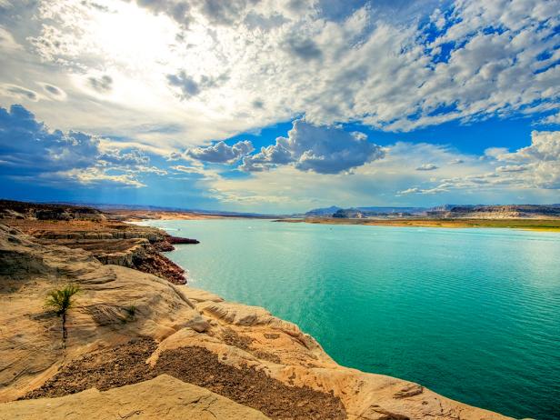 view from road of lake powell with land in a background during the day view from road of lake powell with land in a background during the day