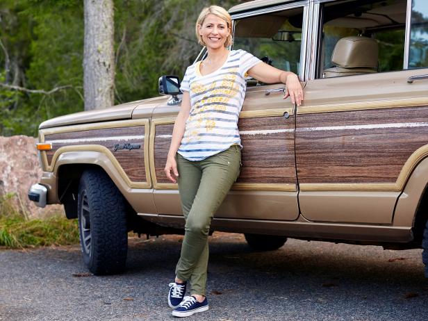 sam brown leaning against a station wagon during the fall