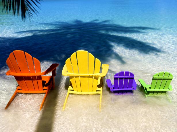 row of colorful adirondack chairs in water row of colorful adirondack chairs in water
