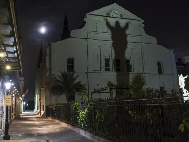 St. Anthony's Garden with a shadow on the rear of St. Louis Cathedral in the French Quarter of New Orleans, LA St. Anthony's Garden with a shadow on the rear of St. Louis Cathedral in the French Quarter of New Orleans, LA