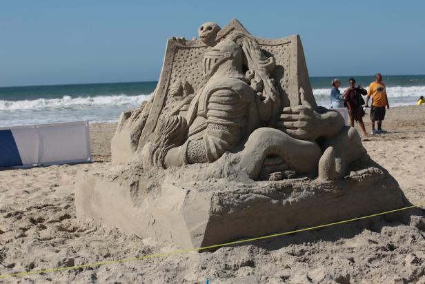 A wide view of an sand sculpture in progress on Pacific Beach, California as seen on Travel Channel.