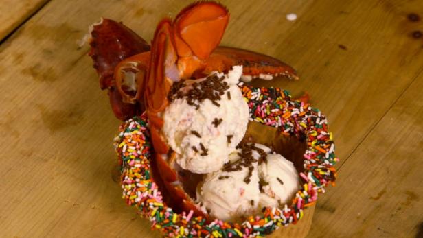 Final plated presentation of Ben and Bills Chocolate Emporium Lobster Ice Cream. Made with rich buttery lobster maine, vanilla ice cream and rainbow sprinkles. As seen on Crazy Delicious