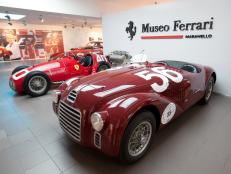 A Ferrari 125 S automobile, produced in 1947, right, sits on display at the Ferrari museum in Maranello, Italy, on Monday, July 18, 2011. Fiat SpA Chief Executive Officer Sergio Marchionne also said that a listing of Ferrari SpA, Fiat's most profitable unit, isn't currently on the table, while it's ''always a possibility.'' Photographer: Victor Sokolowicz/Bloomberg via Getty Images