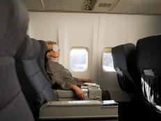 Businesswoman relaxing on airplane