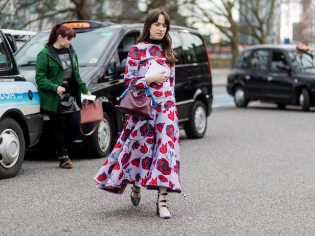 LONDON, ENGLAND - FEBRUARY 20: A guest wearing a dress with floral print outside Christopher Kane on day 4 of the London Fashion Week February 2017 collections on February 20, 2017 in London, England. (Photo by Christian Vierig/Getty Images)