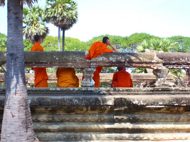 Buddhist Monks on a Bridge in Cambodia