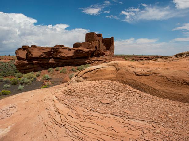 UNITED STATES - 2015/08/07: Red rocks in the foreground of the remains of the Wukoki Pueblo in the Wupatki National Monument Park in northern Arizona, USA, where the Northern Sinagua people lived. (Photo by Wolfgang Kaehler/LightRocket via Getty Images)