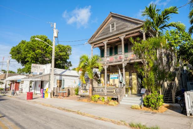 KEY WEST, FLORIDA USA - JUNE 26, 2014: A typical Key West street in the historical district with neighborhood restaurants and retail stores.
