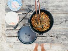 This one-pot meal cooked in a cast iron Dutch oven is very forgiving, and when cooking for a big group at your campsite, the more food the better.