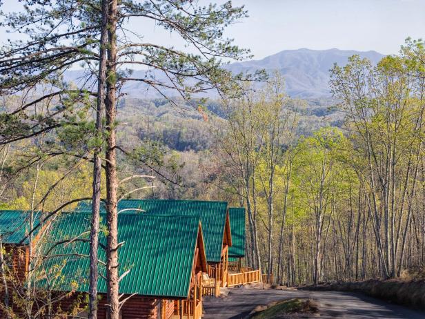 "Log Cabins soak up the view of Mt. LeConte in the Smoky Mountains, Tennessee."