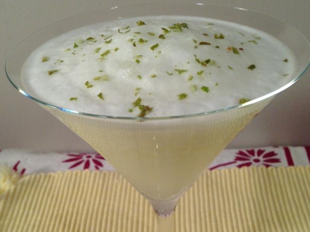 This is a frozen version of the classic Pisco Sour from Peru which includes Pisco, lime juice, simple syrup, egg whites, bitters and lime zest.