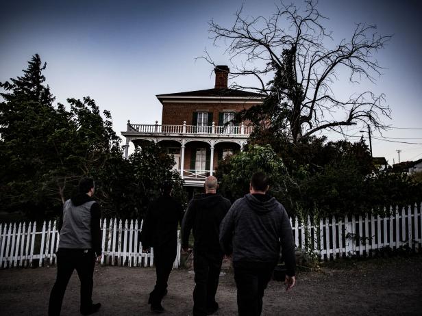 Night scene with a man in front of a vampire manor