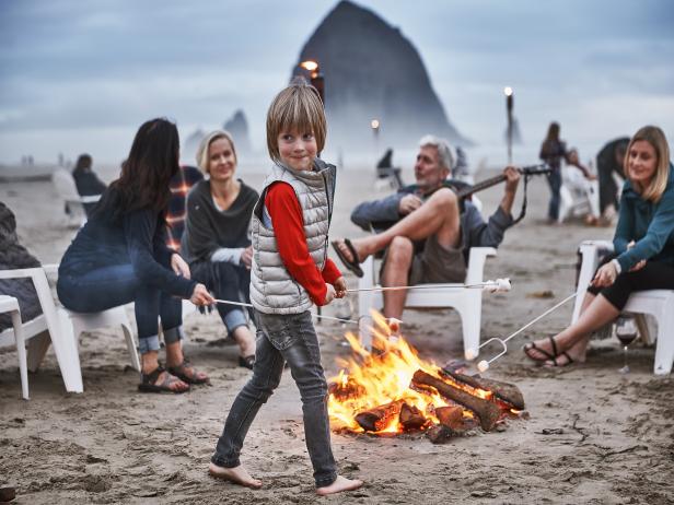 Making s'mores at a beach bonfire at Surfsand Resort
