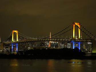 The Rainbow Bridge, in Tokyo, lives up to its name and shines at night, as seen on Travel Channel's Bizarre Foods: Delicious Destinations.