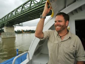 Host Josh Gates takes a ferry along the River Danube, Hungary as seen on Travel Channel's Expedition Unkown.