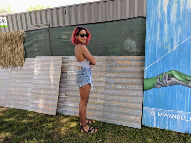 DJ Ayesha Chugh cools off in cut-offs and sandals before playing her set at Bonnaroo.