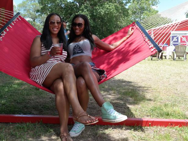 New Jersey siblings Dawn and Crystal Mahoney grab a few minutes together in the shade at Bonnaroo.