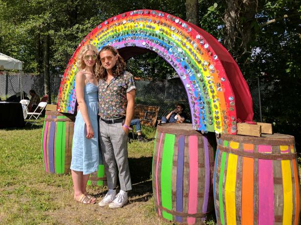 Lucia Wilson and Joe Memmel feel the vibrations of the What Stage while chilling out by the rainbow gate at Bonnaroo.