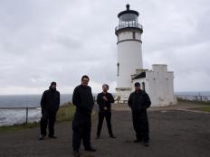 Zak, Aaron, Billy, and Jay stand outside the North Head Lighthouse just outside of Astoria, OR. Today this lighthouse and the nearby keeperâ  s quarters are haunted. People around here donâ  t like to talk about their ghosts. Weâ  re going to see what theyâ  re hiding. There have been 20 shipwrecks along these shores and by the tip of Cape Disappointment. Almost 100 lives have been lost in the shadow of the North Head Lighthouse. Weâ  re surrounded by water and death. 