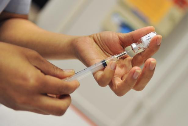 Staff Sgt. Glenda Castillo, 86th Medical Basic Life Support Program director, prepares an influenza vaccine in the immunization section of the clinic, Ramstein Air Base, Germany, April 16, 2012. The clinic recently implemented changes, the result of Air Force Smart Operations 21, allowing them to work more efficiently. (U.S. Air Force photo by Airman 1st Class Caitlin O'Neil-McKeown)  