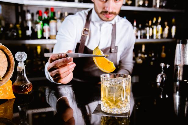 To find this speakeasy-style cocktail join in Mexico City, look for the burly gentleman in a suit standing next to what looks like a refrigerator door.