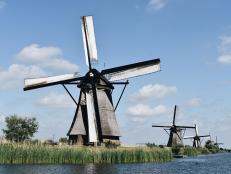 Windmill With Several Windmills in Background 