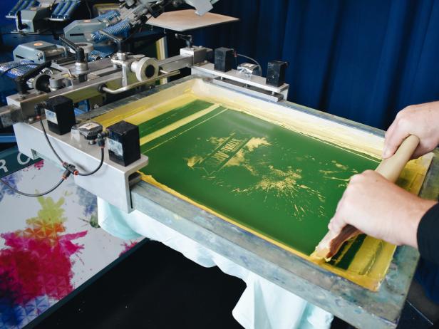 Close Up of Hands Holding Screen Printer