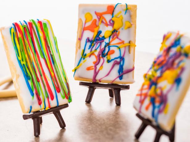 Three Sugar Cookies on Easels With Splatter Painting Icing 