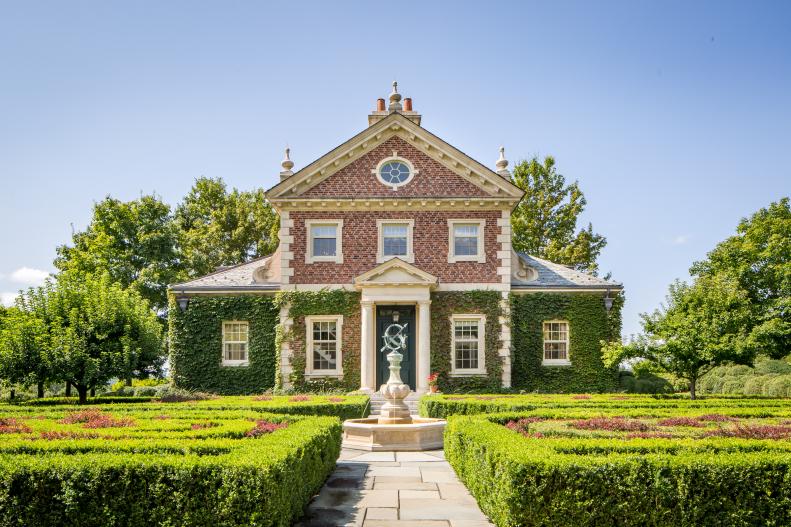 This New England estate, which spans 54 acres just outside the quaint town of Washington, Connecticut, comes with a formal parterre garden that stuns. The elaborately-designed hedges surround a limestone fountain and sundial. It all makes for an impressive backyard for the classically-designed brick home, listed for $6.5 million.