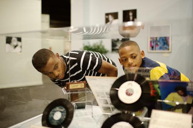 Visitors to the Augusta Museum of History view the James Brown exhibit.