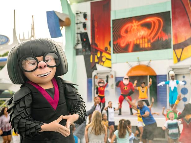 Edna Mode With Incredibles Cast in Background