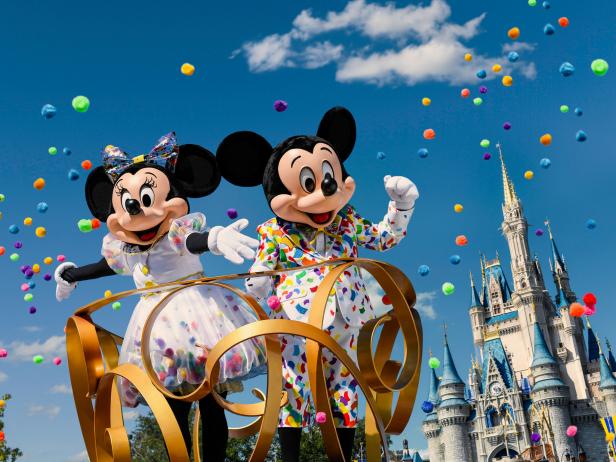 Mickey and Minnie on Parade Float With Castle in Background