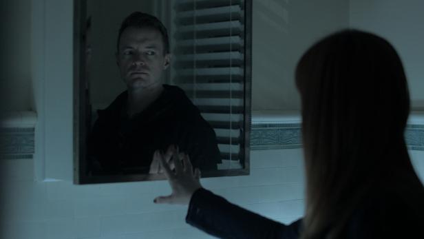 Amy Bruni looks in Lizzie Borden's mirror and sees Adam Berry.