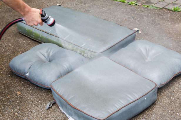 Generously spray down each cushion with water, making sure the cushions are damp but not fully soaked.