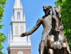 Paul Revere statue in Boston Freedom Trail, a national landmark and major tourist attraction. Old North Church steeple in the back.iStock_000009413960Small