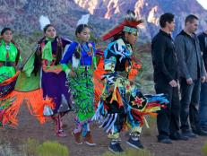 Zak, Nick and Aaron watch as members of the Paiute tribe do a traditional dance.
